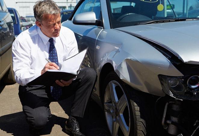 close-up of car insurance certificate and car keys